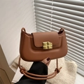 Caramel brown vintage crossbody bag with gold chocolate-shaped lock and PU leather strap - Tan