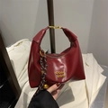 Vintage style dark red glossy leather dumpling crossbody bag with gold hardware and charms - With Pendant / Red