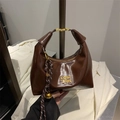 Dark brown patent leather underarm tote bag with gold metal logo and bell pendant - With Pendant / Coffee