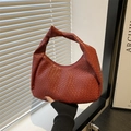 Chic woven hobo bag in brick red faux leather with stylish knotted shoulder strap detail - Red