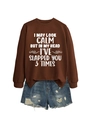 Close-up of brown crewneck sweatshirt with white slogan print and denim shorts - Coffee (White Print)