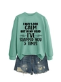 Detail of mint green sweatshirt with slogan text and distressed denim shorts set - Light Green (Black Print)