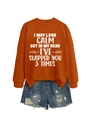 Flat lay of women's orange slogan sweatshirt and distressed blue denim shorts set - Burnt Orange (White Print)