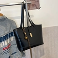 Black leather tote bag with gold metal buckle and woven strap for daily commuting - With Pendant / Black