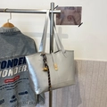 Silver PU leather tote bag with metallic finish and decorative woven charm - With Pendant / Silver