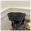 Detailed side view of black matte waist bag with metal zipper and nylon strap - Black