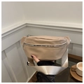 Detailed view of beige canvas chest bag with silver metal zipper and wide woven strap - Khaki