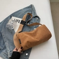 Minimalistische khakifarbene Cord-Umhängetasche in Zylinderform mit verstellbarem Gurt - Khaki