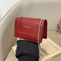 Fashionable red square shoulder bag with gold chain strap and elegant flap design - Red