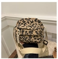 Close-up of leopard print corduroy crossbody bag with woven zipper and strap detail - Khaki