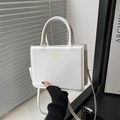 Minimalist white square crossbody handbag with golden Fashion Bag lettering and handle - White
