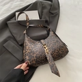 Vintage leopard print crescent bag with golden buckle and sleek leather shoulder strap - Brown