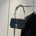 Minimalist black leather shoulder bag with gold T-logo and chain strap detail - Black