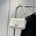 Minimalist white leather crossbody bag with iconic gold T-shaped metal buckle detail - White
