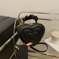 Chic black heart-shaped handbag with quilted pattern and unique ruched cloud handle - Black