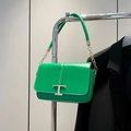 Minimalist green leather crossbody bag with iconic gold T-lock and chain strap - Green