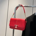 Minimalist red leather crossbody bag with gold T-shaped metal clasp and chain strap - Red