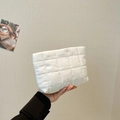 Chic white quilted handheld makeup bag in glossy finish with elegant pleated design - White