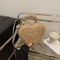 Beige heart-shaped faux leather handbag with quilted layers and ruffled handle - Khaki