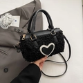 Black faux sherpa cylinder bag with heart patch and leather handles for women - Black