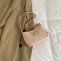Pink minimalist crescent shoulder bag with a silver metallic bow and pleated texture finish - Pink