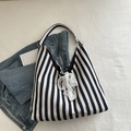 Navy and white striped canvas tote bag with white lace bow detail and black trim finish - Blue