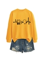Flat lay of yellow long sleeve sweatshirt with ECG print and frayed denim shorts - Yellow Sweatshirt (Black Font)