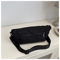 Top view of a black nylon crossbody bag featuring double silver zippers and wide strap - Black