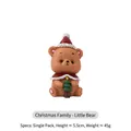 Christmas bear figurine wearing a red hat holding a green tree decor for desktop - Christmas Bear