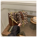 Detail of leopard print flap bag featuring gold metal trim and chain strap accent - Brown