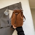 Brown suede drawstring bucket bag with leather strap and minimalist silver hardware - Brown