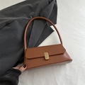 Minimalist brown faux leather baguette shoulder bag with golden metal twist lock - Tan