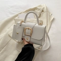 White crossbody bag set with gold horseshoe buckle and textured faux leather finish - White