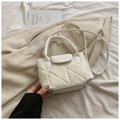 Detail of white quilted crossbody bag with glossy finish and fashion lettering on the flap - White