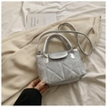 Silver-grey quilted crossbody bag with triangle stitching and metallic finish detail - Silver