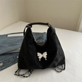 Black crinkle tote bag with silver butterfly charm and chain straps in a versatile style - Black