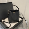 Matte black leather bucket bag with fashion print and adjustable crossbody strap - Black