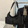 Versatile black canvas messenger bag with multi-pocket workwear style for daily use - Black
