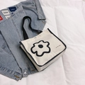 Retro canvas tote bag with black flower print and Korean text in beige finish - Black