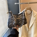 Stylish leopard print crescent underarm bag with knotted strap and gold hardware accents - Black