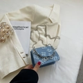 Mini crossbody chain bag with light blue floral texture and silver flower pendant - Blue