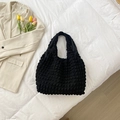 Borsa a secchiello nera minimalista con trama a sbuffo e motivo a bolle - Nero