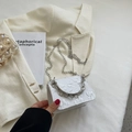 White mini crossbody bag with embossed floral texture and silver chain strap - Off White