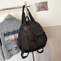 Versatile black nylon backpack featuring large capacity and multiple functional pockets - Black