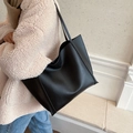 Classic large black tote bag in premium faux leather with minimalist shoulder straps - Black
