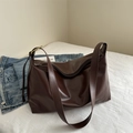 Large dark brown faux leather tote bag with wide strap for daily commute use - Brown