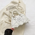 White bat-shaped crossbody bag with black spider web embroidery and gold hardware - White