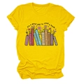 Close-up of vibrant yellow cotton tee featuring a colorful book and floral graphic print - Yellow (Black Text)