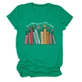 Detailed view of green cotton T-shirt featuring colorful books and floral graphic print - Ink Green (White Text)