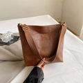 Brown patchwork bucket bag in vintage style with wide fabric strap and golden hardware - Brown